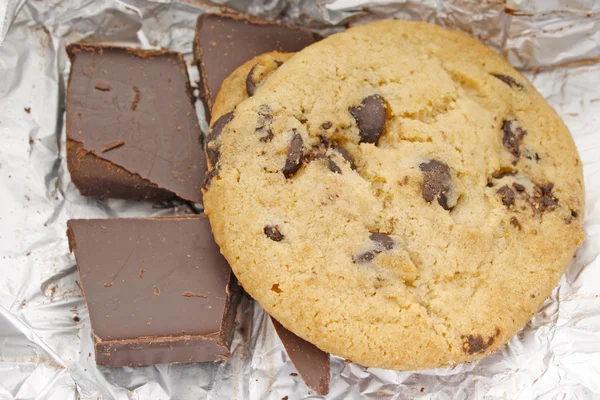 stock image Сhocolate and cookies on the foil