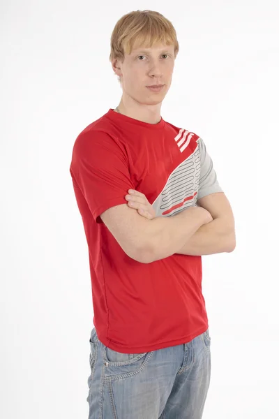 Portret van een knappe man in een rode t-shirt op witte achtergrond — Stockfoto
