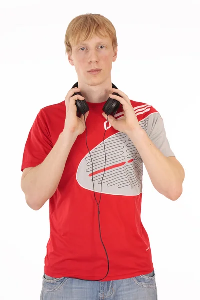 Poważny młody student słuchu muzyka na białym tle — Zdjęcie stockowe