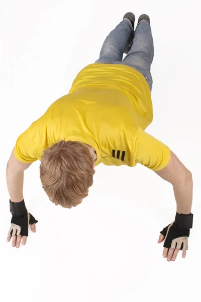 Frisk ung man att driva upp motion isolerad på vit — Stockfoto