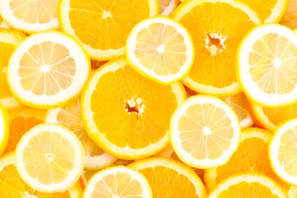 Plátky pomeranče, citrony, citrusových plodů pozadí — Stock fotografie