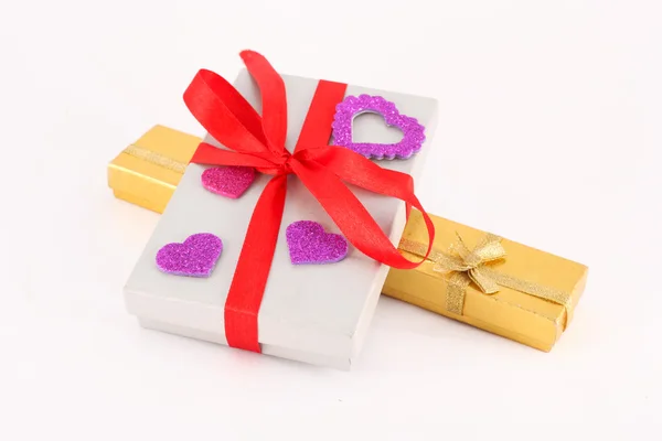 Close up of gifts box with red bow isolated — Stock Photo, Image
