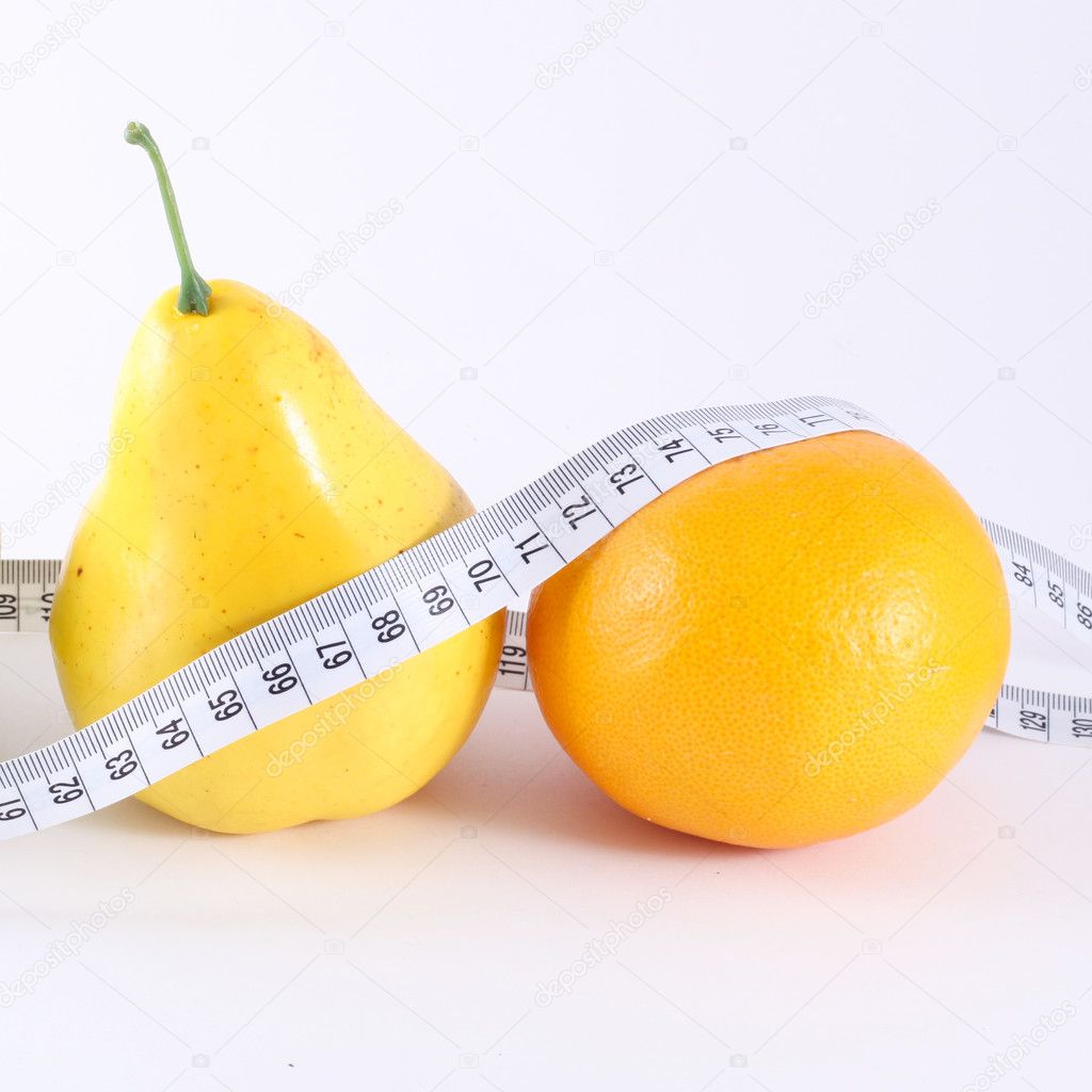 Diet concept. Fruits with measuring tape isolated on white