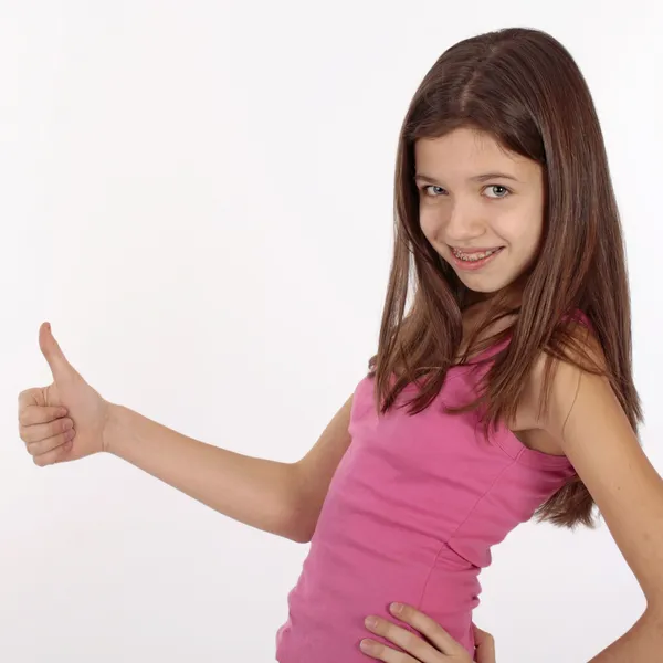 Adolescente menina branca beleza mostrando seus polegares para cima. Isolado em branco . — Fotografia de Stock