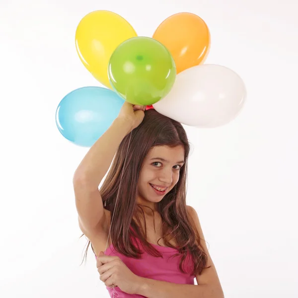 Χρόνια Κόμματος εφηβικό κορίτσι με μπαλόνια πάνω από λευκό — Φωτογραφία Αρχείου