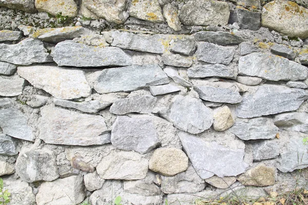 Un vecchio muro di pietra — Foto Stock