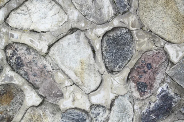 Een oude stenen muur — Stockfoto