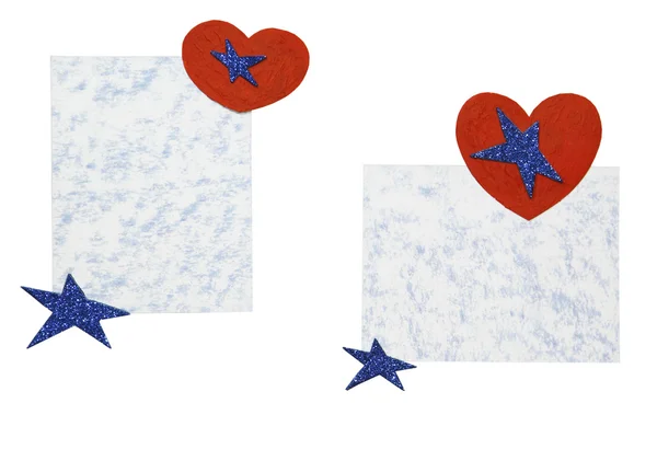 Sheets of paper with hearts and stars on a white background