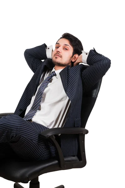 Businessman relaxing on office chair — Stock Photo, Image