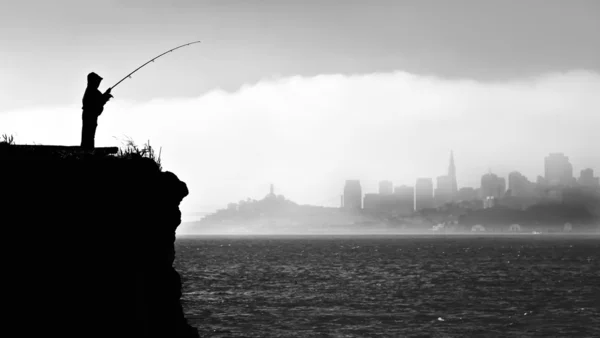 Silhouette of a fisherman in San Francisco — Stock Photo, Image