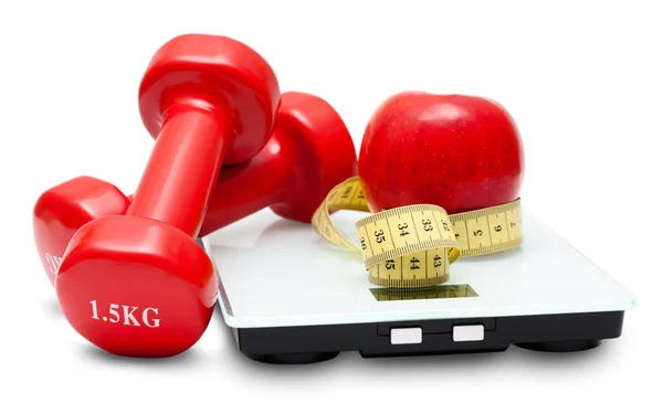 Mérlegek, súlyzók, piros alma és mérőszalag — Stock Fotó