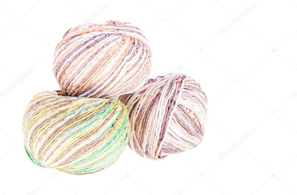 Three balls of colored cotton knitting yarn