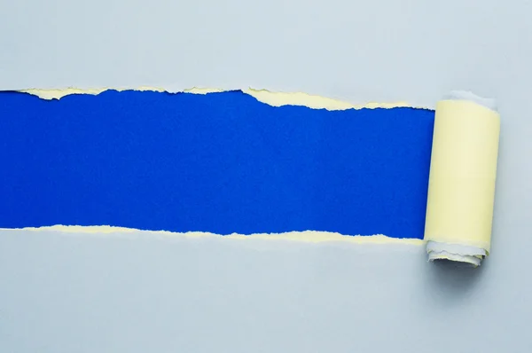 Torn blue and yellow paper with space for text — Stock Photo, Image
