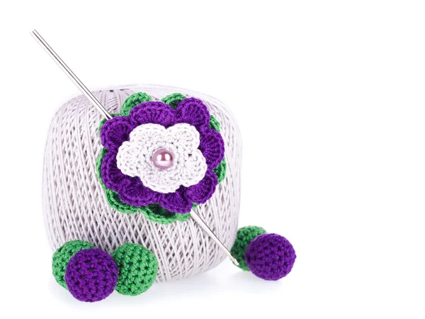 Grey ball of cotton knitting yarn with crochet, knitted flower and beads — Stock Photo, Image
