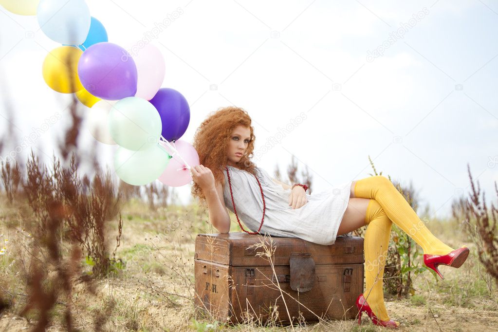 Woman with colored ballons