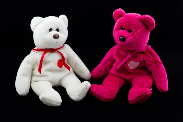 stock image Shot of two teddy bear's on black background