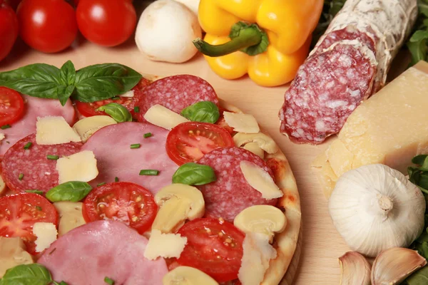 Pizza with ham and salami — Stock Photo, Image
