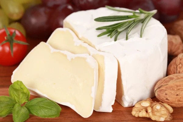 stock image Still life with Camembert cheese cut on slices