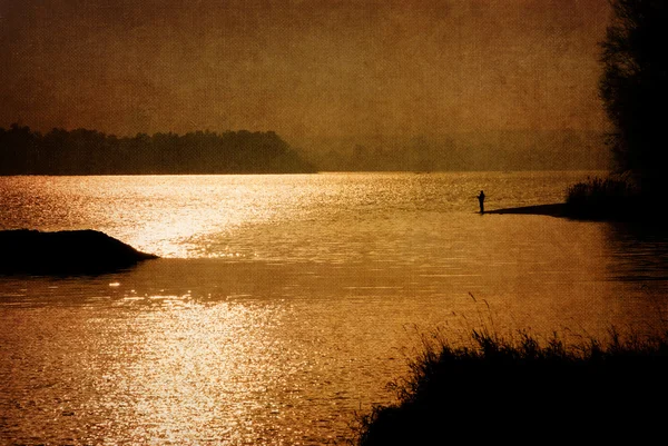 Fisherman at sunset — Stock Photo, Image