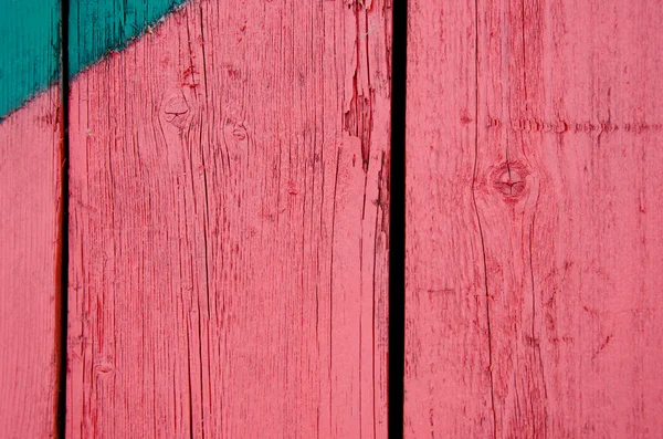 Achtergrond van houten rode verf bestuur muur close-up — Stockfoto