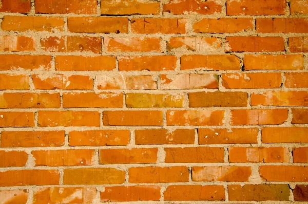 Achtergrond van rode bakstenen muur fragment. — Stockfoto