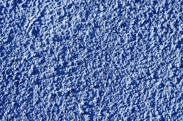 Paredes texturizadas pintadas de azul primer plano macro detalles . — Foto de Stock