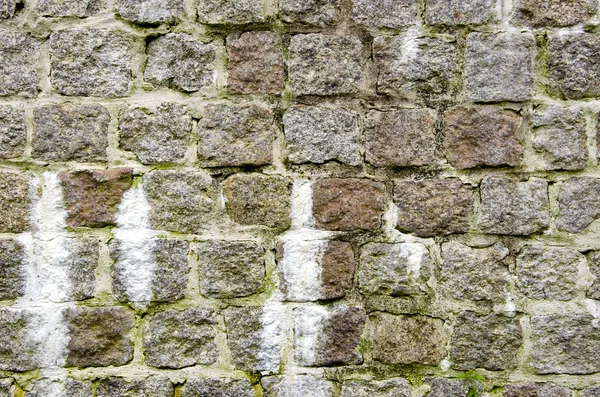 Hintergrund der alten dekorativen Steinmauer. — Stockfoto