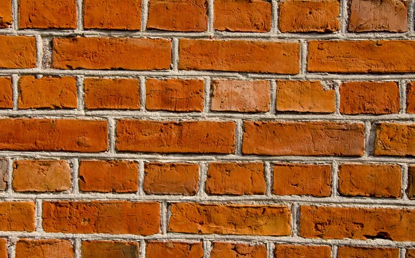 Muur gebouwd van rode baksteen architectonische details. — Stockfoto