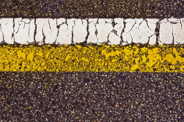 アスファルト道路マーク マクロ背景白黄色ライン — ストック写真