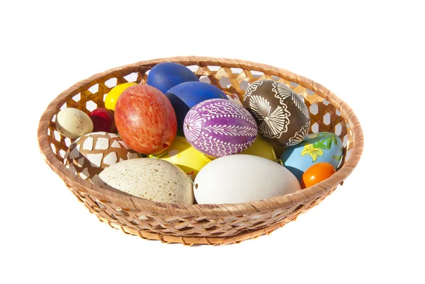 Painted Easter eggs wicker dish table decoration — Stock Photo, Image