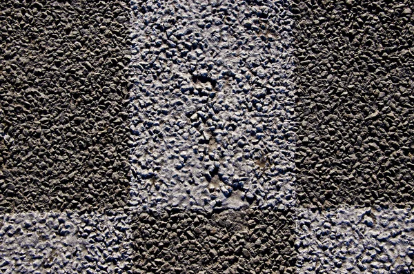 Background macro closeup of asphalt road marks — Stock Photo, Image