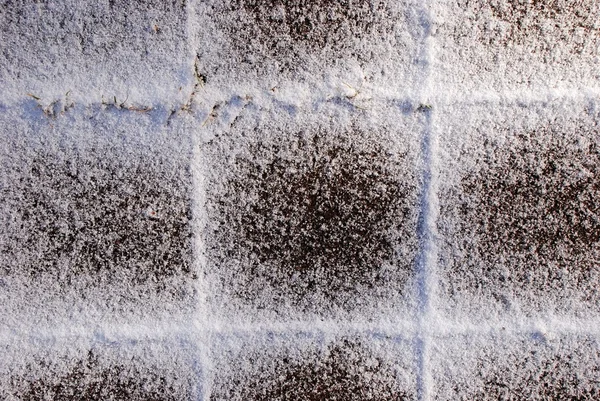 Snow-covered tiles — Stock Photo, Image