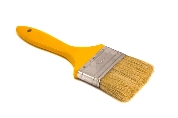 Brush 75mm wide yellow shaft paint isolated — Stock Photo, Image