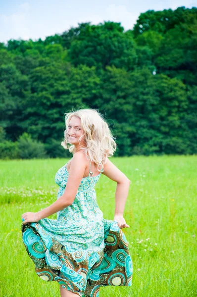 Beautiful girl running on the meadow — Stock Photo, Image