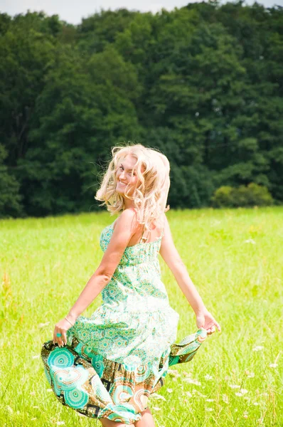 Beautiful girl running on the meadow — Stock Photo, Image