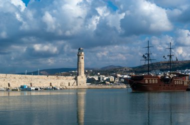 View of lighthouse in the Venetian Harbor Of Rethymnon clipart