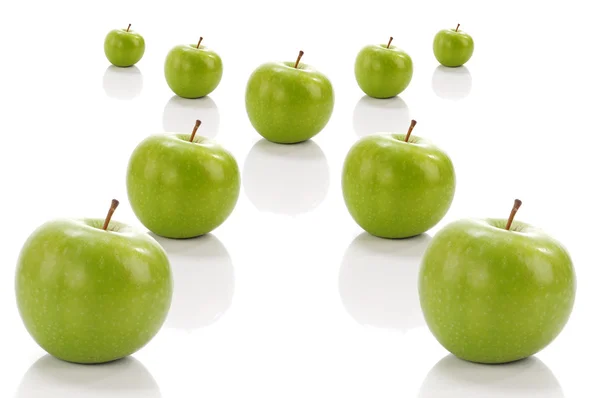 Green apple in cross position — Stock Photo, Image