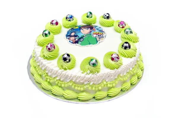 Bílé polevy dort s zelenou dekorativní krémem — Stock fotografie