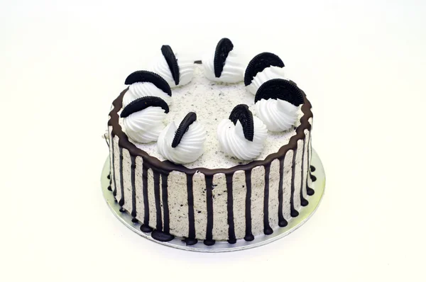 White vanilla cake with cookies and chocolate stripe — Stock Photo, Image
