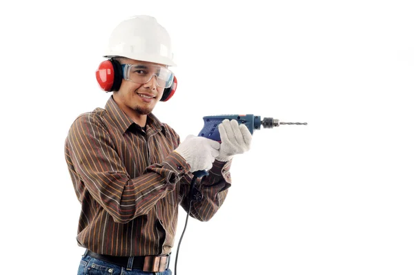 Pracowników uśmiech trzymając wiertarka z bezpieczeństwa — Zdjęcie stockowe