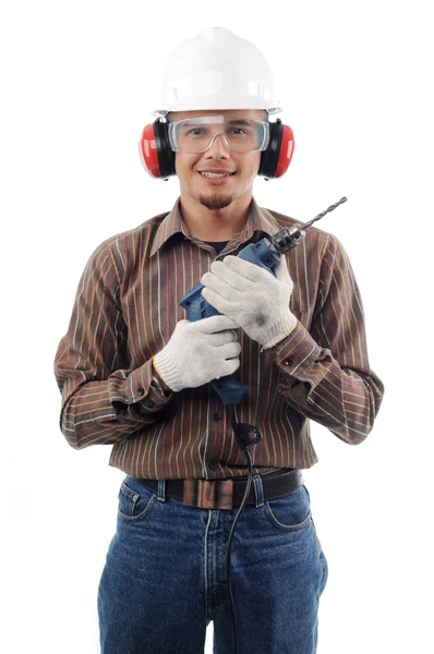 Pracowników uśmiech trzymając wiertarka z obiema rękami — Zdjęcie stockowe