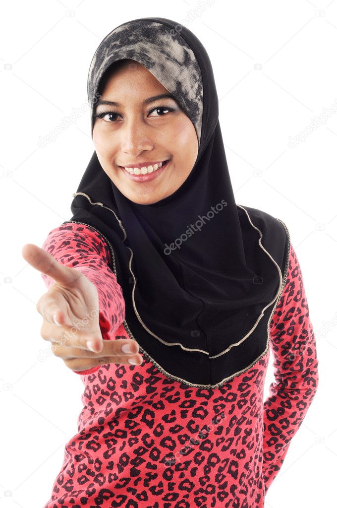 Beautiful young muslim women smile while extend her hand