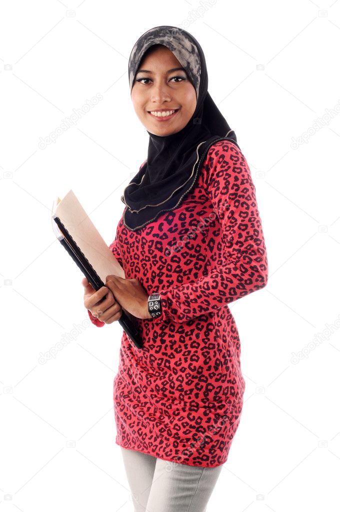 Beautiful young muslim holding books smile