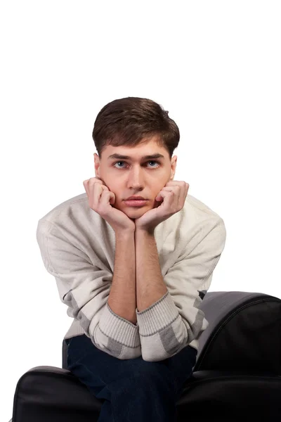 Thoughtful young man on the sofa — Stock Photo, Image