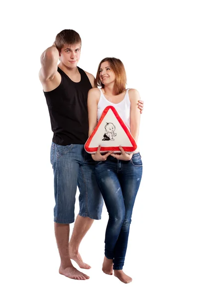 Couple holding a pillow — Stock Photo, Image