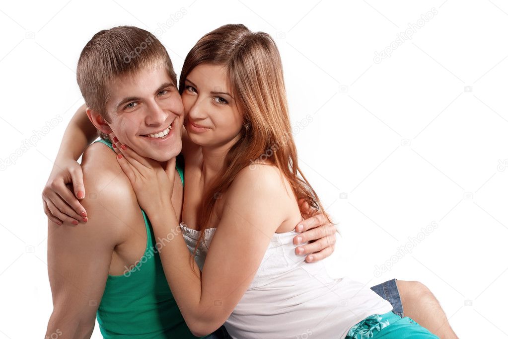 Young man and woman in love hug each other