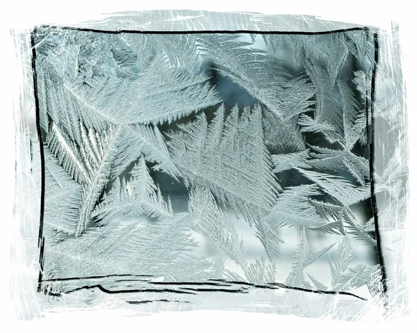 Ледяные узоры на стекле — стоковое фото