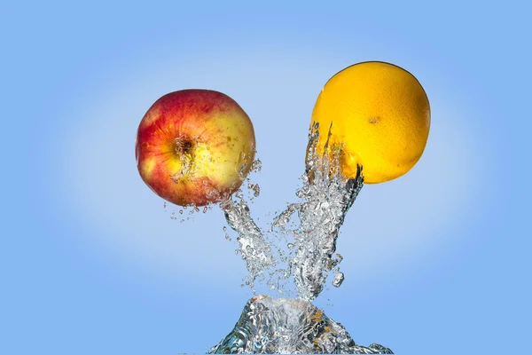 Fruit shooting out of water. — Stock Photo, Image