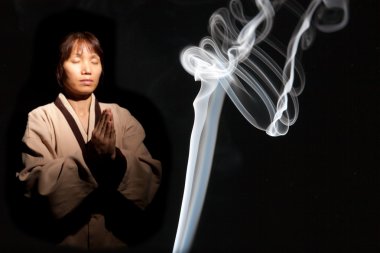 Incense smoke and Asian woman. clipart