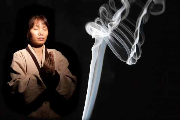Incense smoke and Asian woman. — Stock Fotó